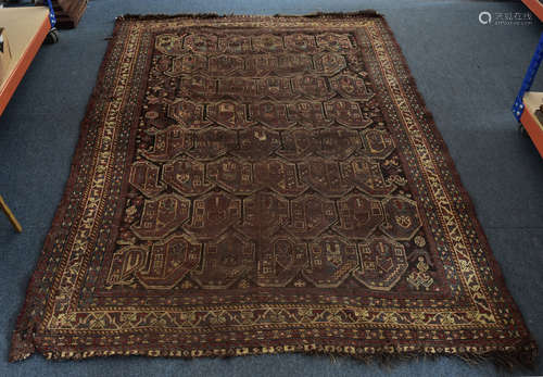 A middle eastern wool rug, with all over central repeating pattern of mother and child motifs within