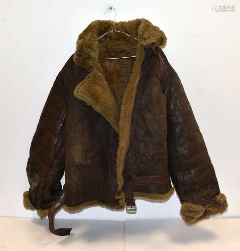A WWII brown leather flying jacket, unnamed, together with a military pocket compass in leather