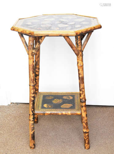 An Edwardian octagonal bamboo occasional table, with decoupage decoration of shells, stretcher