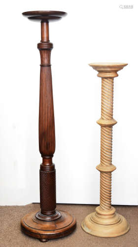 A 19th Century mahogany and walnut tapered column torchere, on bun feet, 126 cm high together with a