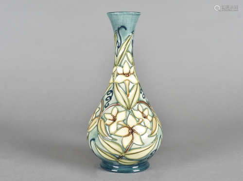 A Moorcroft pottery bottle vase, tube-lined Carousel pattern, with printed and impressed factory