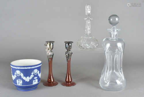 A pair of cranberry glass and silver overlaid candlesticks, two decanters and stoppers and a