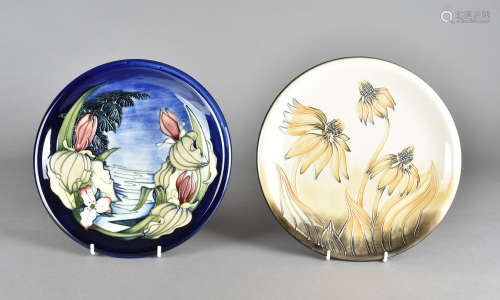 Two Moorcroft pottery plates, both tube-lined, Sweet Betsy pattern and Cone Llower, both printed and
