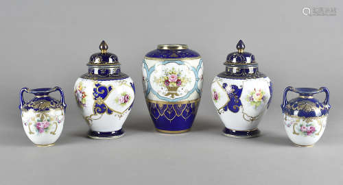 A pair of Noritake porcelain vases and covers, the white ground with floral sprays with in blue
