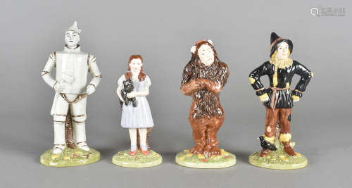 A collection of Royal Doulton Wizard of Oz figurines, comprising Scarecrow, Lion, Tin Man and