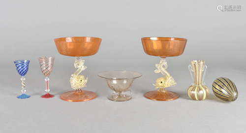 A pair of Venetian orange and gilt inclusion comports, with dolphin shaped stems, 14 cm high