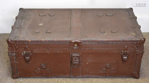 A large hard canvas travelling trunk, with painted brown exterior, green interior, 88 cm x 32 cm
