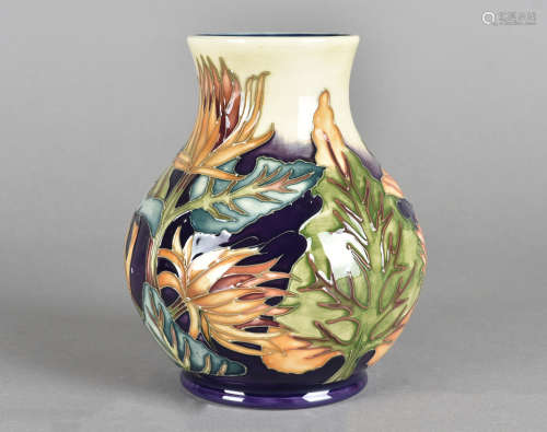 A Moorcroft pottery ovoid vase, tube-lined Burdock pattern, printed and impressed factory marks to