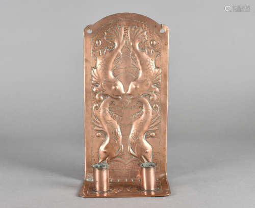 An art nouveau copper wall sconce, with hammer beaten decoration of fish, 28 cm x 14 cm