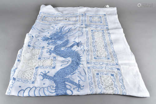An early 20th Century cotton and Peking knot embroidered table cloth, depicting the blue dragons and