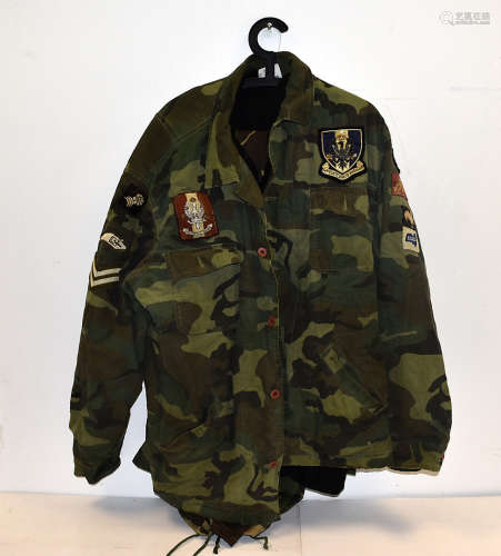 A Men's Combat smock, together with a collection of various items of clothing having numerous