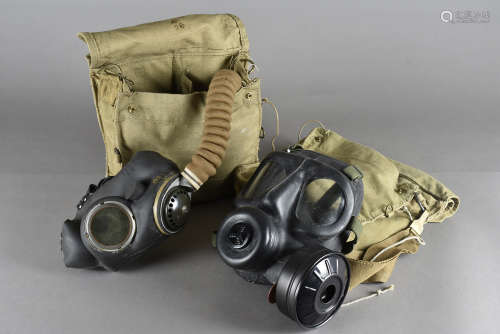 A WWII British No.4 III B2/41 gas mask, complete with filter and pipe, in canvas bag marked Maple