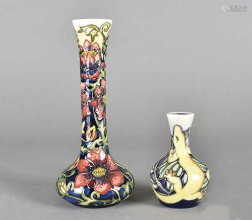 Two Moorcroft pottery vases, tube-lined decoration, 10.5 cm, together with a Peacock Eye bottle