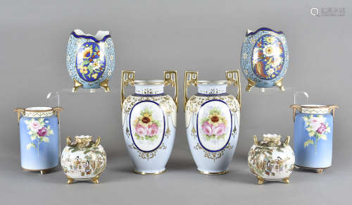 A pair of Noritake porcelain vases, modelled as broken eggs, on three gilt legs, simulated cloisonné