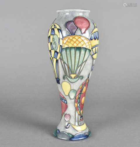 A Moorcroft pottery baluster vase, tube-lined Balloon pattern, printed and impressed factory marks