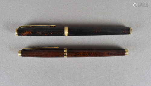 Two Parker fountain pens, both marked France, with enamel lacquered cap and bodies, 18 c gold and 14