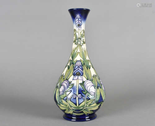 A limited edition Moorcroft pottery ovoid bottle vase, tube-lined decoration, Wolsbane by Anji