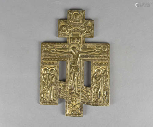 A Russian gilded brass crucifix, depicting Christ in Jerusalem above a buried skull surrounded by