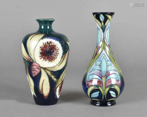 Two Moorcroft pottery vases both with tube-lined design, one tapered bottle vase, Albany pattern,