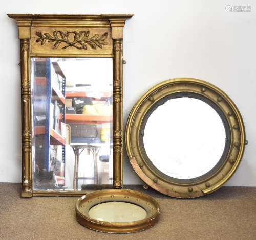 A 19th Century gilt over looking glass with column supports, 97 cm x 66 cm, together with two