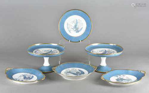A part Limoges Art Deco desert service, having central decoration of an exotic bird over a costal