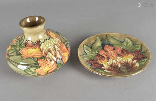 Two Moorcroft pottery items including a small plate and squat vase, both with tube-lined Flame of