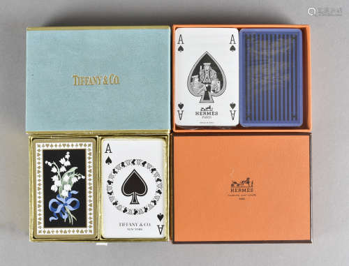 A Hermes cased set of playing cards, still in cellophane wrapping and a Tiffany set