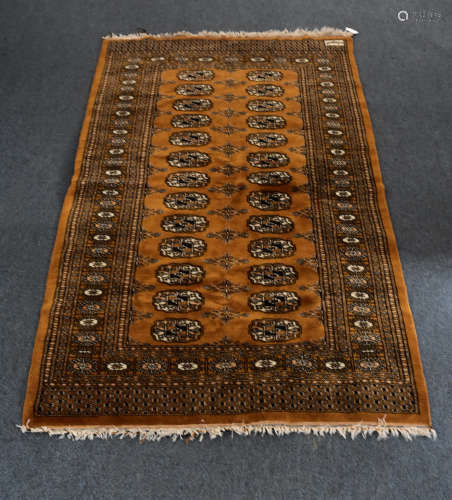 A middle eastern wool turkoman style carpet, central panel with stylised gulls surrounded by