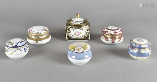 A collection of porcelain boxes and covers, all by Noritake, decorated with floral sprays heightened