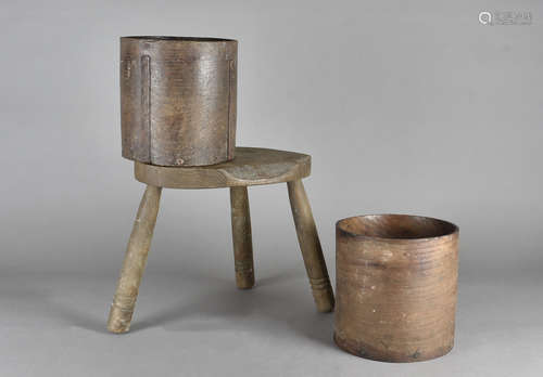 A pair of Elizabeth II 1 gallon grain bushels, and a three footed milking stool