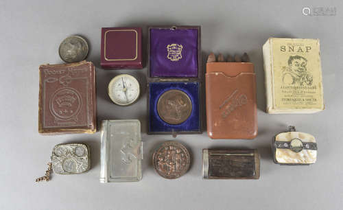 Two bronze medallions, one in white metal, a novelty set of cigar pencils, a mother of pearl purse