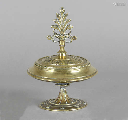 An 18th Century bronze comport and cover, with lift off lid and anthemion finial on a circular