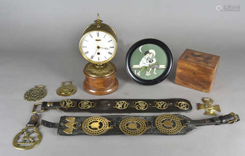 A pair of leather and brass martingales, together with a collection of horse brasses, and a brass