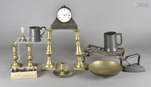 Two pairs of brass candlesticks, a Victorian pewter tankard, another smaller, a drum mantel clock,
