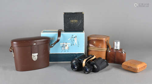 A cased pair of Carl Zeiss binoculars, in leather case, a Smiths leather travel clock and a pair