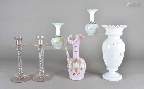 A pair of pink glass candlesticks, a pair of vaseline spill vases, a Victorian crimped glass jug and