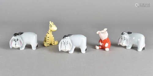 A collection of five Beswick Winnie the Pooh characters, including three Eeyore, one seated Piglet
