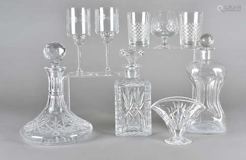 A collection of cut glass decanters, four brandy balloons, six wine glasses with engraved bowls,