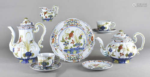 An extensive Italian polychrome decorated dinner service, the tin glazed earthenware decorated