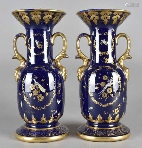 A pair of Masons Ironstone style twin handled vases, the cobalt blue glaze heightened in gilt with