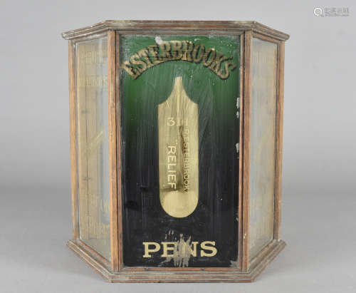 An Esterbrooks pens oak and glass shop display pen cabinet, of triangular shape with green and