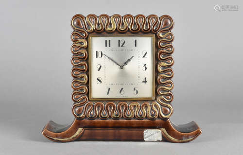 A French post war pottery mantel clock, with scroll design, in brown and gilt, 30 cm wide x 24 cm