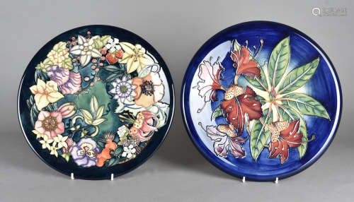Two large Moorcroft hanging wall plates, one after a design by Rachel Bishop, tube-lined Carousel