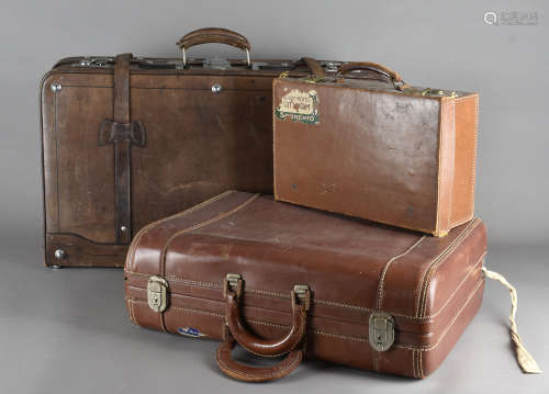 Seven 20th Century suitcases, majority covered with leather, all with locks and handles, assorted