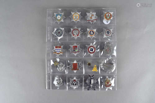 A group of British and overseas cap badges, to include Hong Kong, Nigerian, London City Airport,