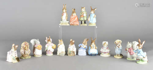 A collection of Beswick Beatrix Potter figures, including a Gold Backstamp Peter Rabbit, printed