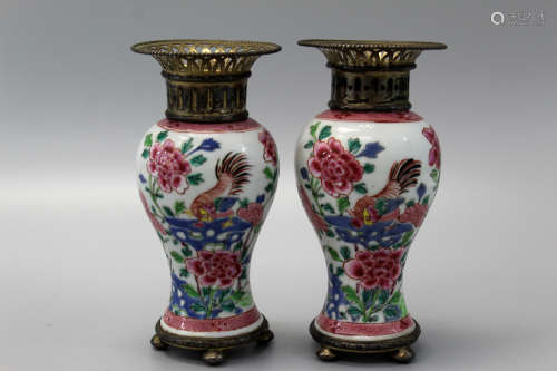 A pair of Chinese famille rose porcelain vases with European Silver mounting. 18th C.