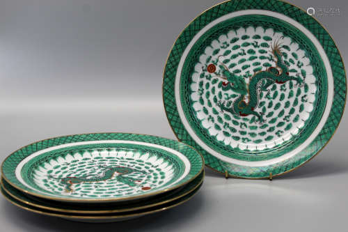 Four Chinese green dragon porcelain dishes.