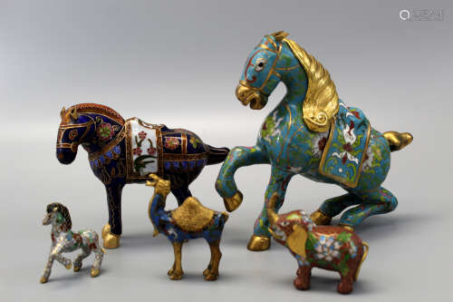 A group of Chinese cloisonne horses.