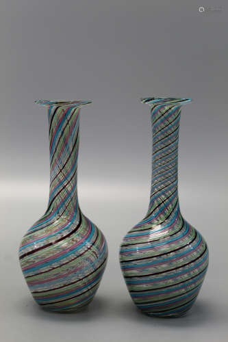A pair of multi-color strip glass vases.